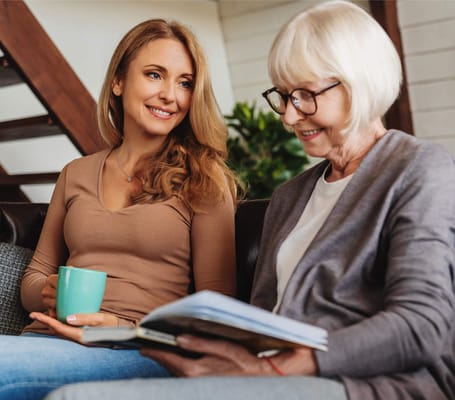 Two women engaged in conversation in a cozy setting