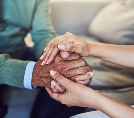Two hands clasped in companionship