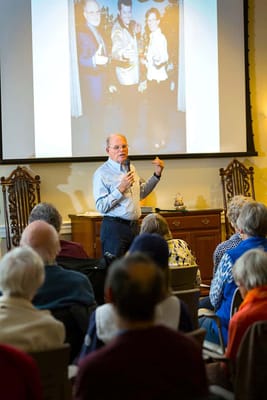 Residents engaged in a presentation with a speaker