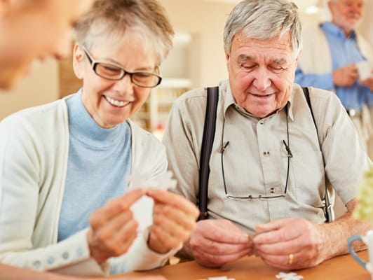 Residents engaged in a puzzle activity
