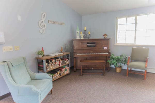 Cozy common area with piano and seating