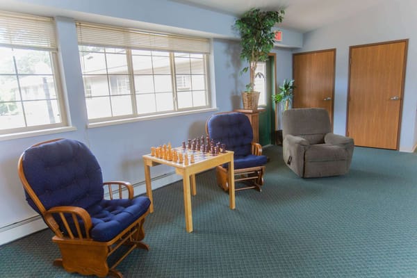 Interior common area with seating and chess set