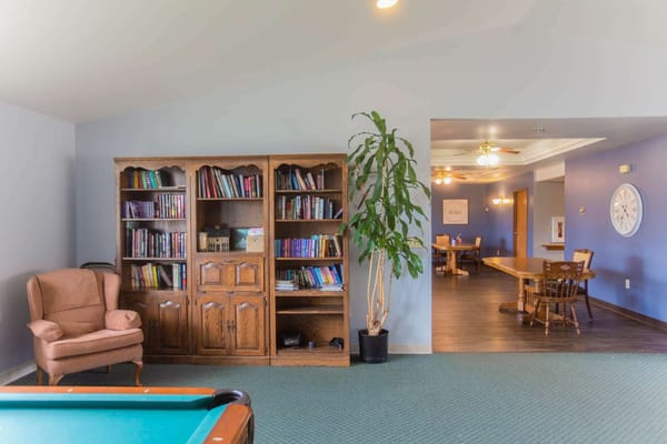 Interior common area with bookshelves and seating