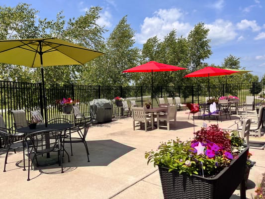 Patio area with umbrellas and flower planters
