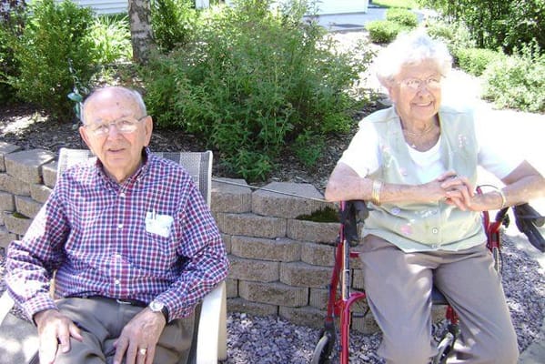 Two residents enjoying the garden area