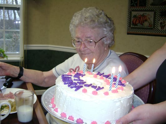 Resident celebrating a birthday with a cake