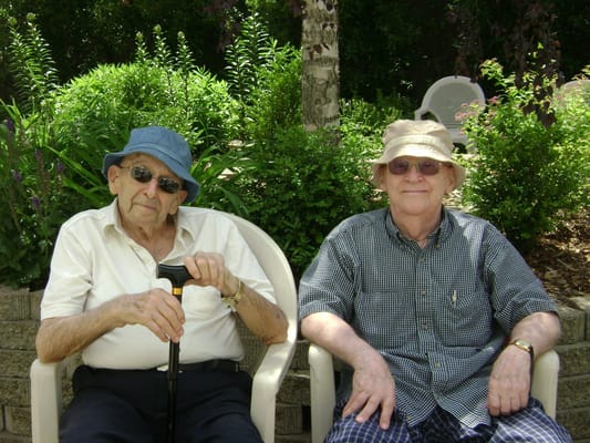 Two residents enjoying a sunny day in the garden