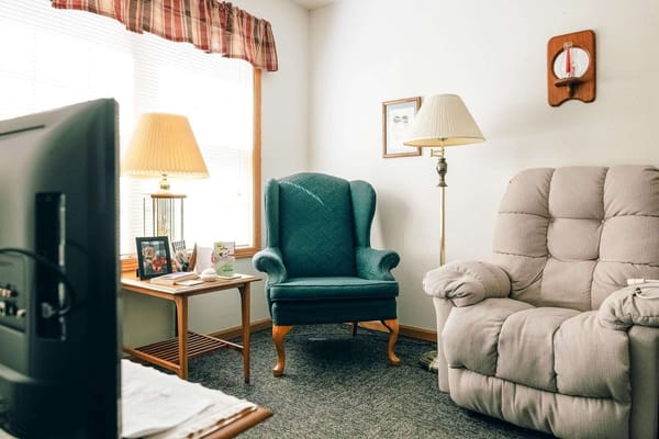 Cozy lounge area with seating and decorative lamp
