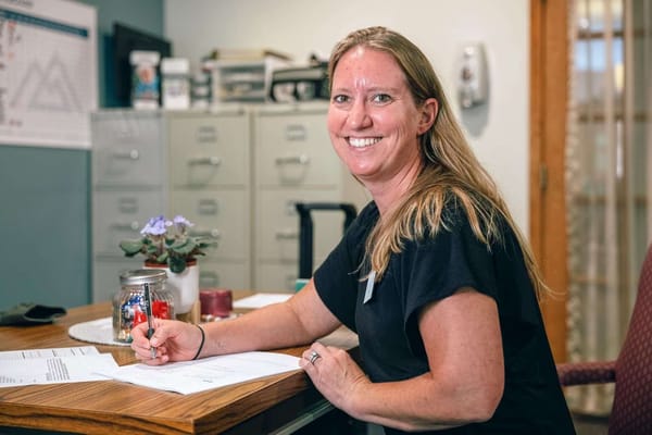 Staff member assisting at the reception desk