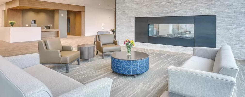 Modern common area with seating and decorative fireplace