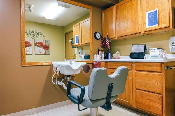 Interior view of a salon area with styling chair