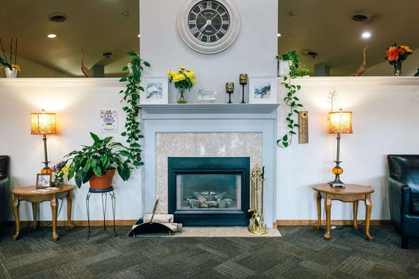 Cozy common area with fireplace and plants