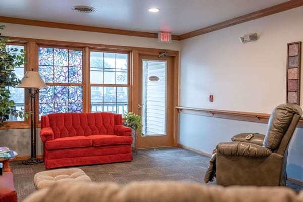Bright common area with couches and large windows