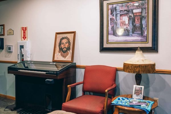 Cozy interior space with piano and artwork