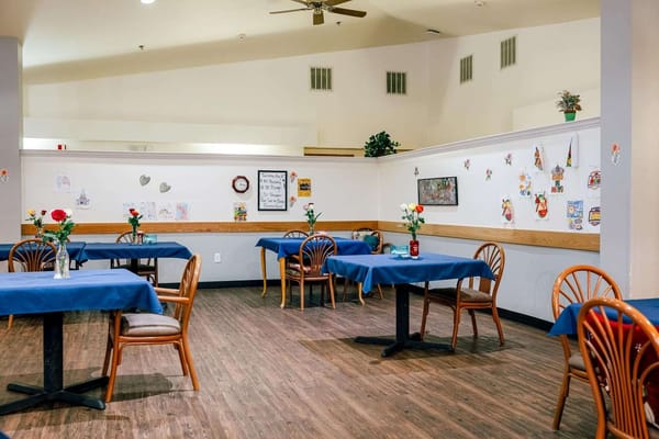 Dining area with tables and flower centerpieces