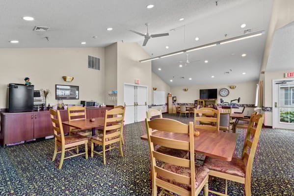 Bright common area with tables and chairs