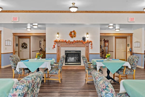 Cozy dining area with tables set for residents