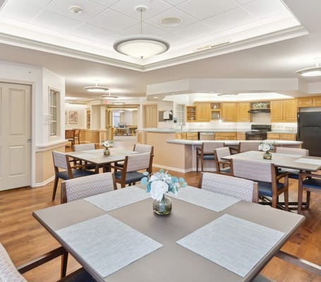 Bright dining area with tables set for meals