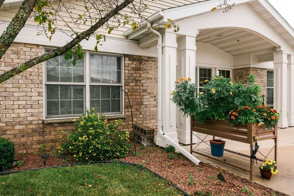 Exterior view of a flower planter near the entrance