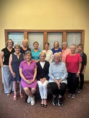 Residents and staff posing together in a common area
