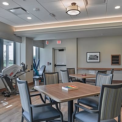Bright and modern common area with tables and chairs