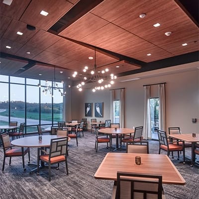 Bright dining room with modern decor and large windows
