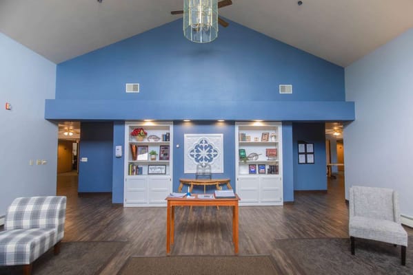 Bright common area with chairs and decor
