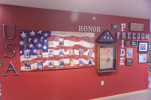 Interior wall with patriotic decorations and photos