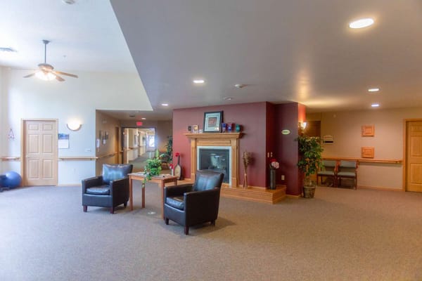 Interior common area with seating and a fireplace