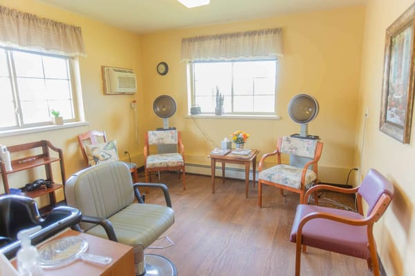 Cozy interior of a resident room with seating
