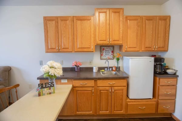 Interior view of a resident kitchen with warm tones