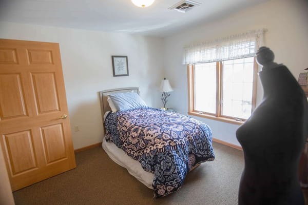 Cozy private room with a bed and window