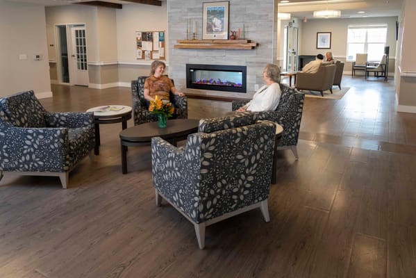 Residents chatting in a comfortable common area