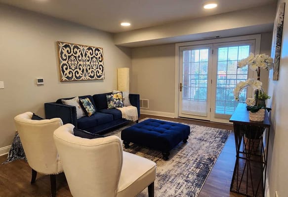 A cozy common area with seating and decorative accents