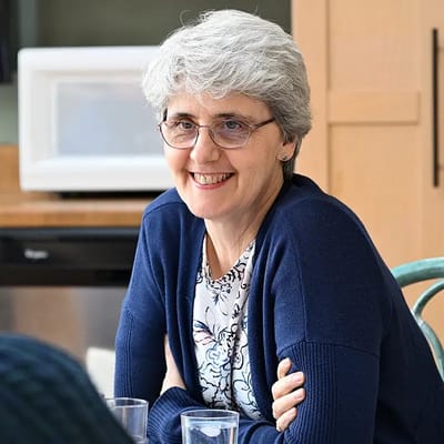 A smiling woman in an indoor setting