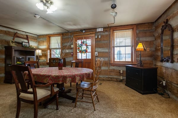 Cozy common area with wooden decor and a round table