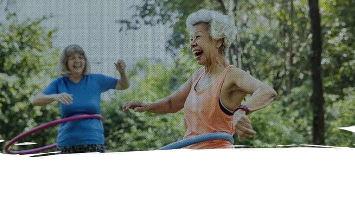 Seniors enjoying a hula hoop activity outdoors