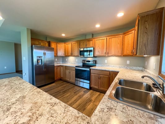 Modern kitchen with wooden cabinets and appliances