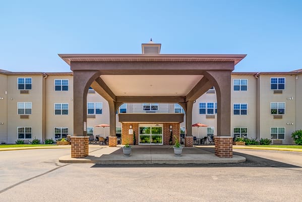 Building exterior with entrance and outdoor seating area