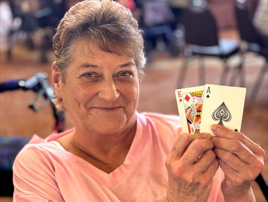 Resident enjoying a card game in common area