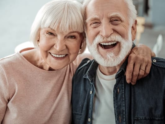 Two smiling residents posing together