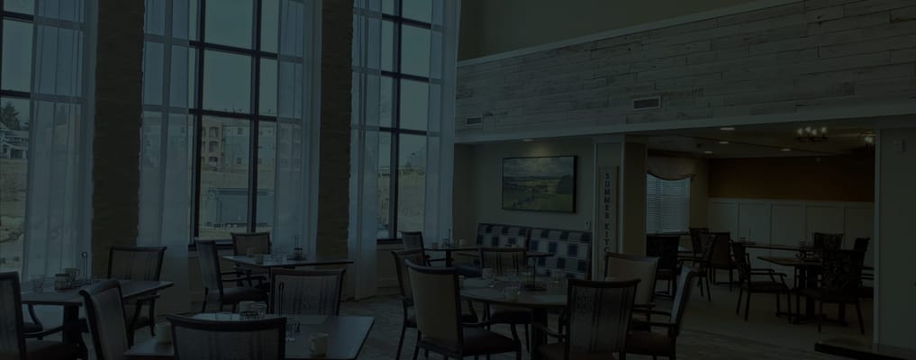 Dining area with large windows and tables set up