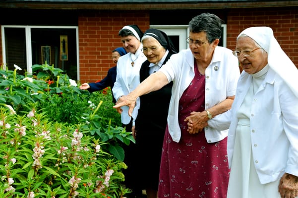 Residents enjoying the garden at the facility