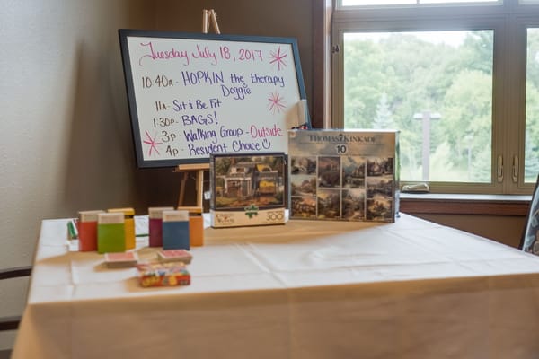 Activity schedule and games displayed on a table