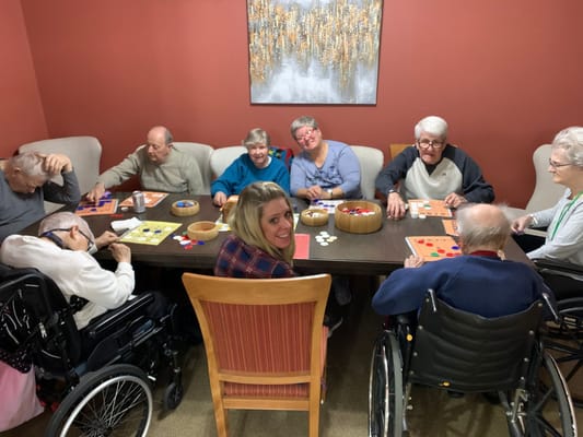 Residents playing bingo in an activity room