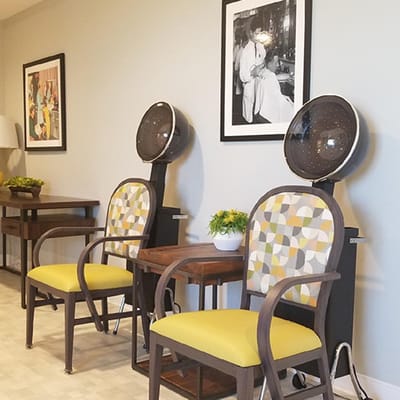 Hair salon area with seating and decor