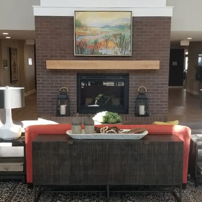 Cozy common area with fireplace and artwork