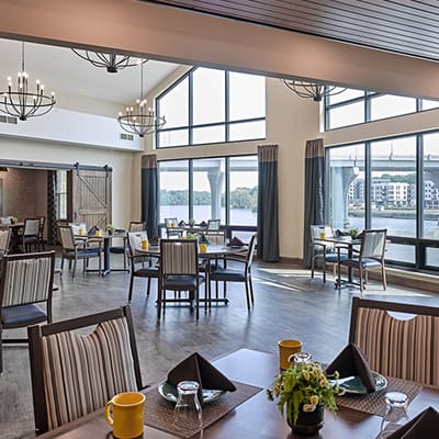 Bright dining room with large windows and elegant decor
