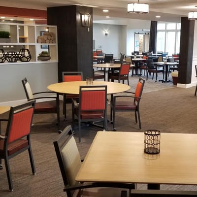 Interior view of a common area with tables and chairs