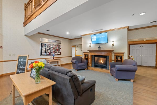 Cozy interior lounge with a fireplace and seating